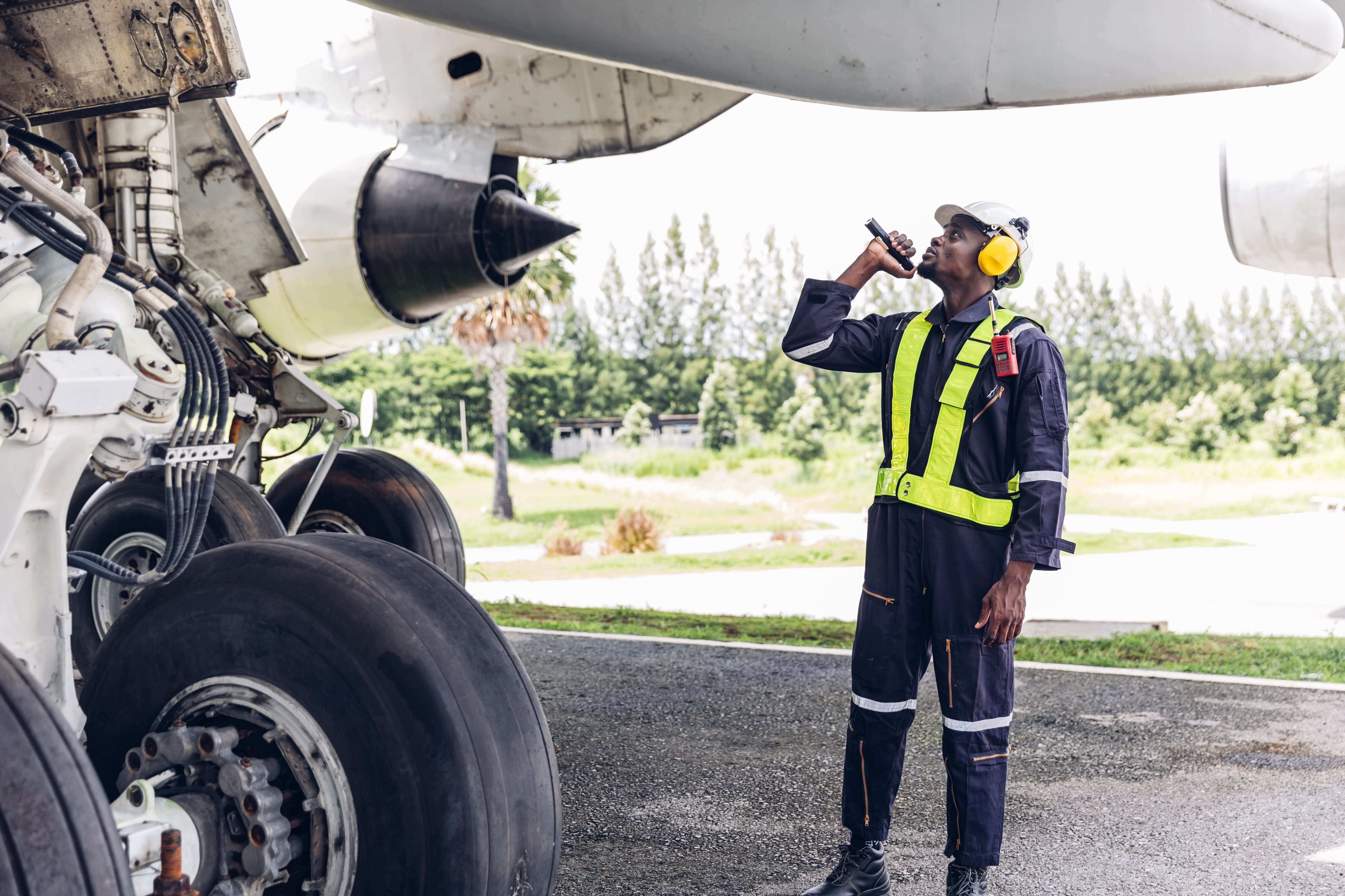 Ground crew servicing an aircraft to industry standards